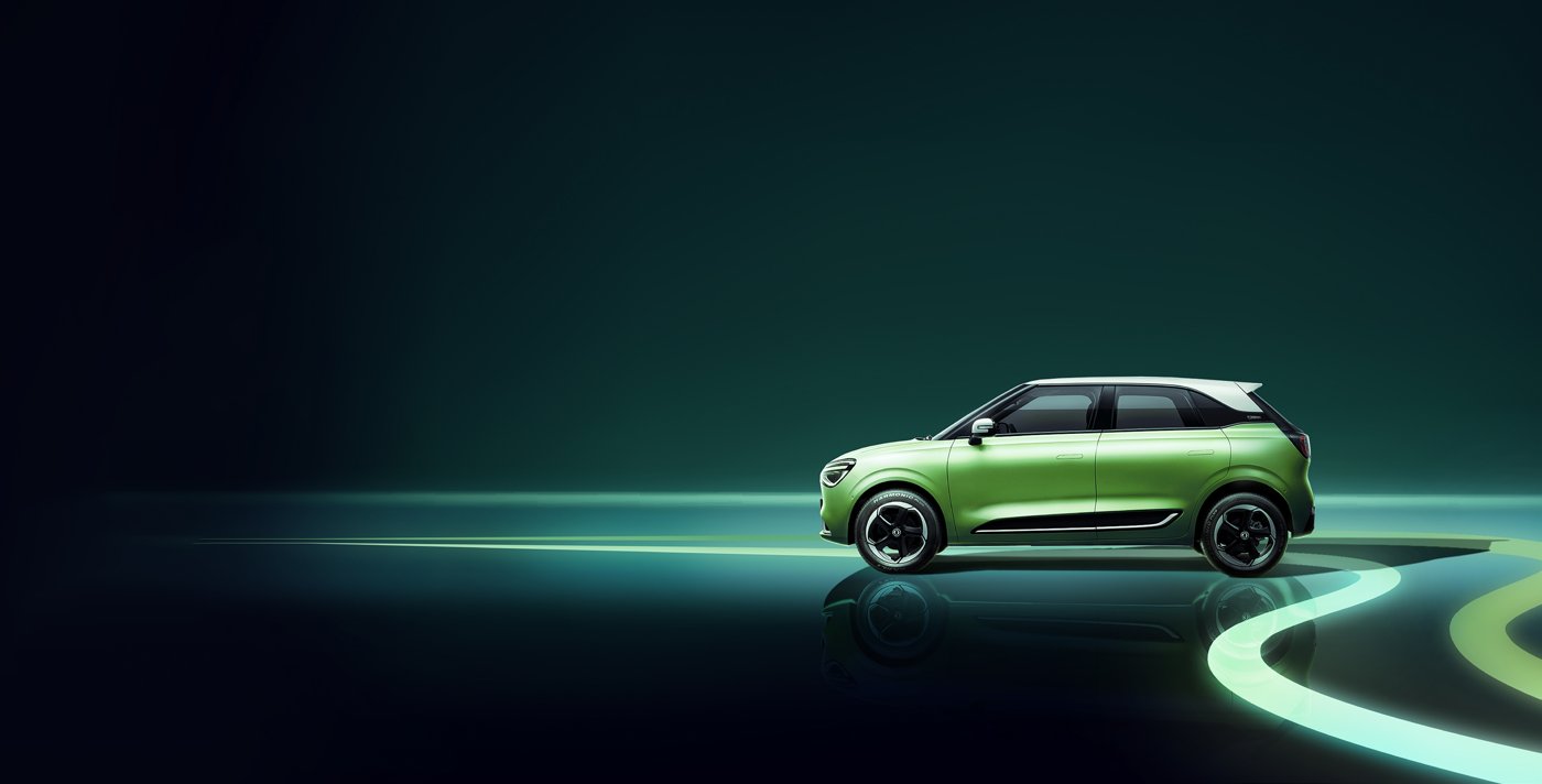 Green Dongfeng Box electric hatchback in side profile with a white roof